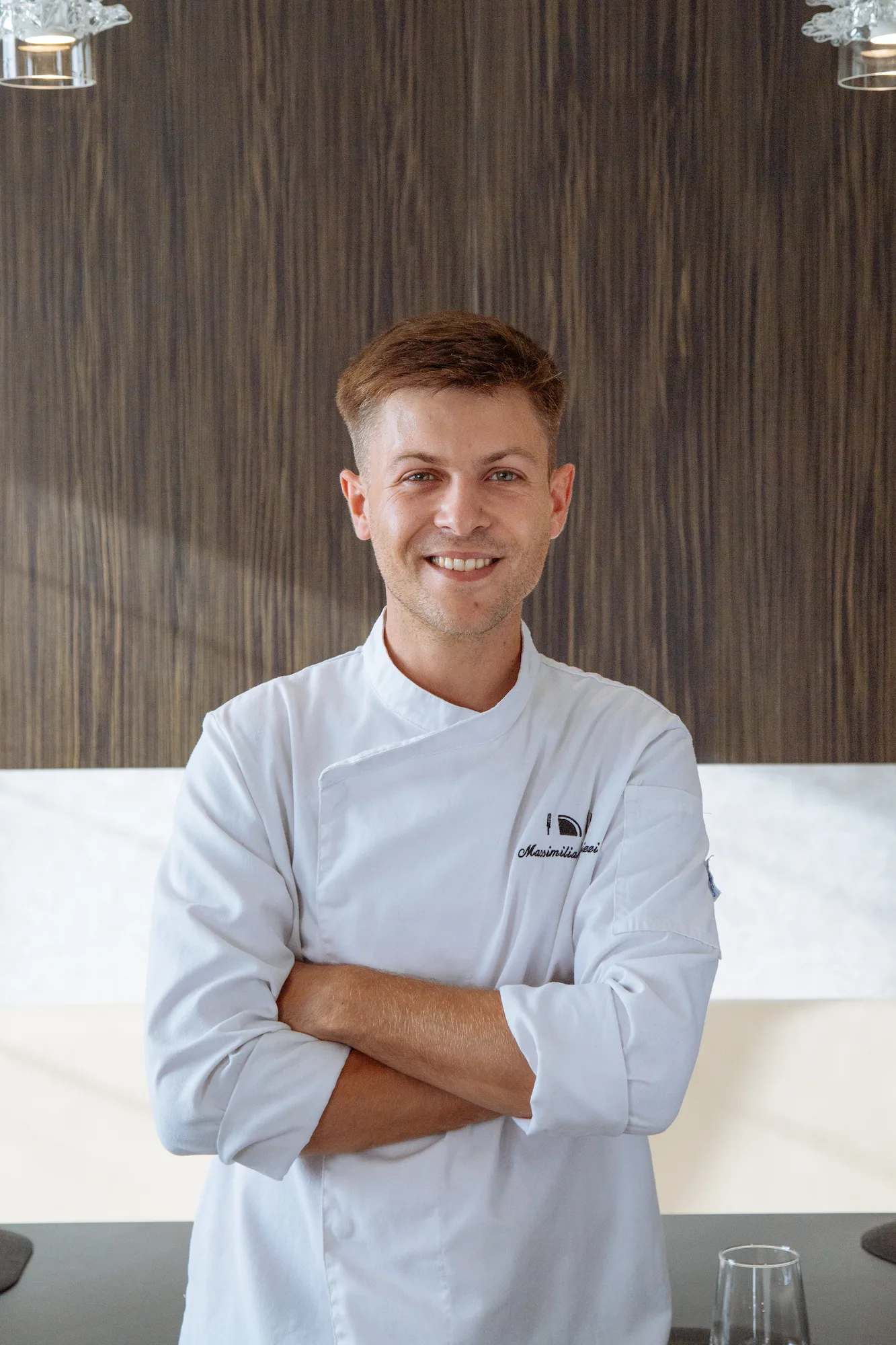 Chef Massimiliano Bizzi del Ristorante Unico di Cantù, alla guida di una cucina contemporanea e stagionale.