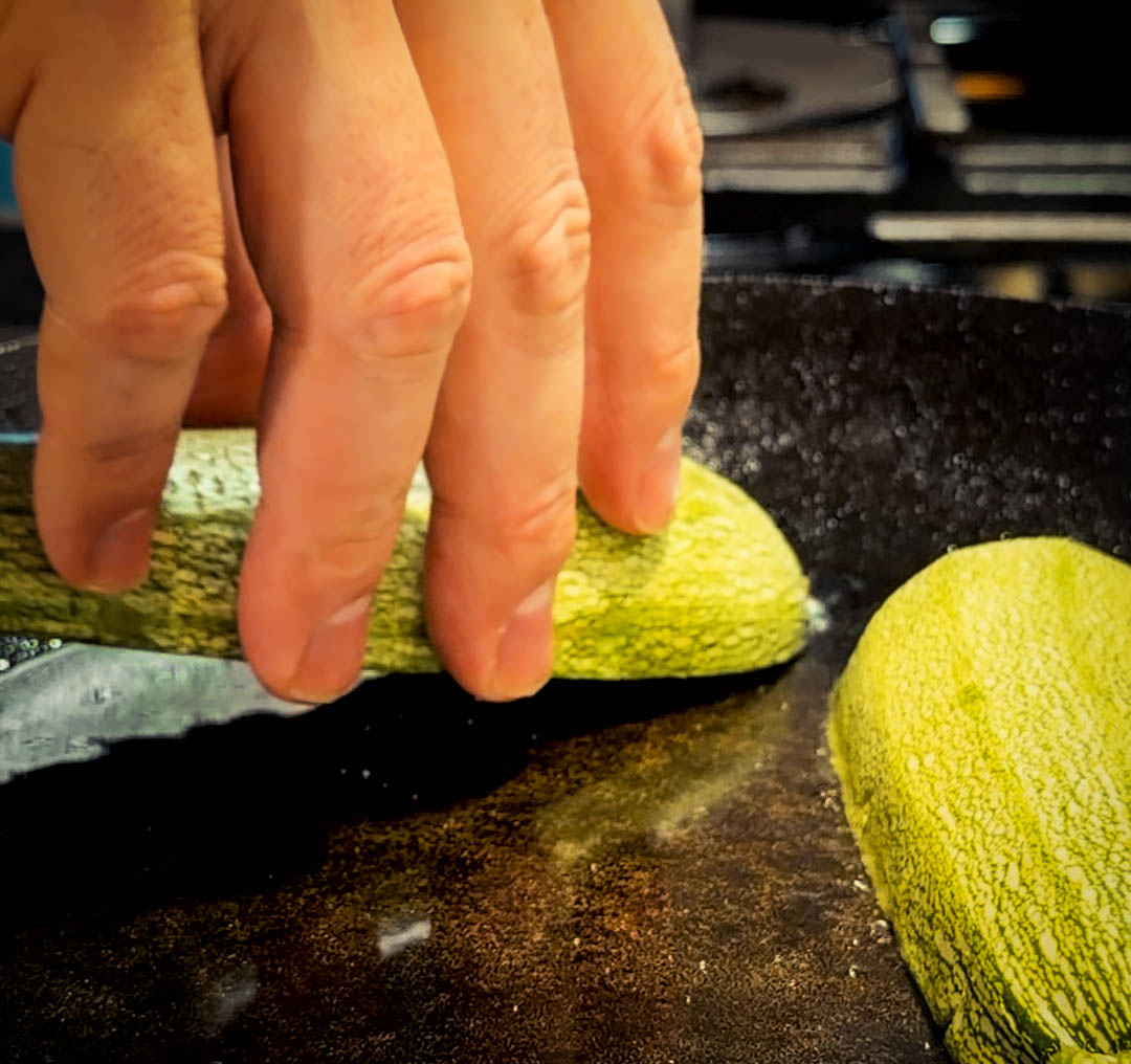 zucchini going down in a pan