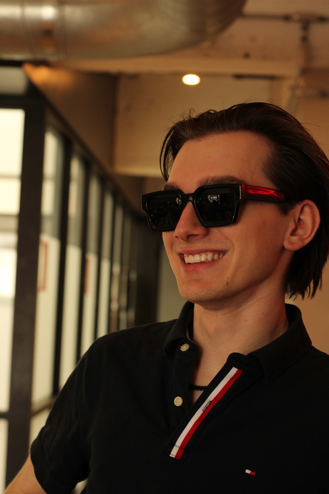 a blurry photo of a person standing in front of a wall