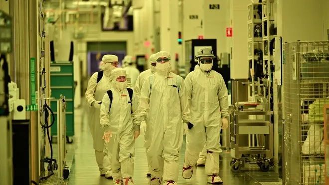 a black and white living room with a large tv