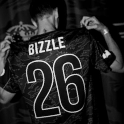 Bizzle’s X profile avatar: person holding up a “BIZZLE 26” jersey from behind against a dark backdrop.