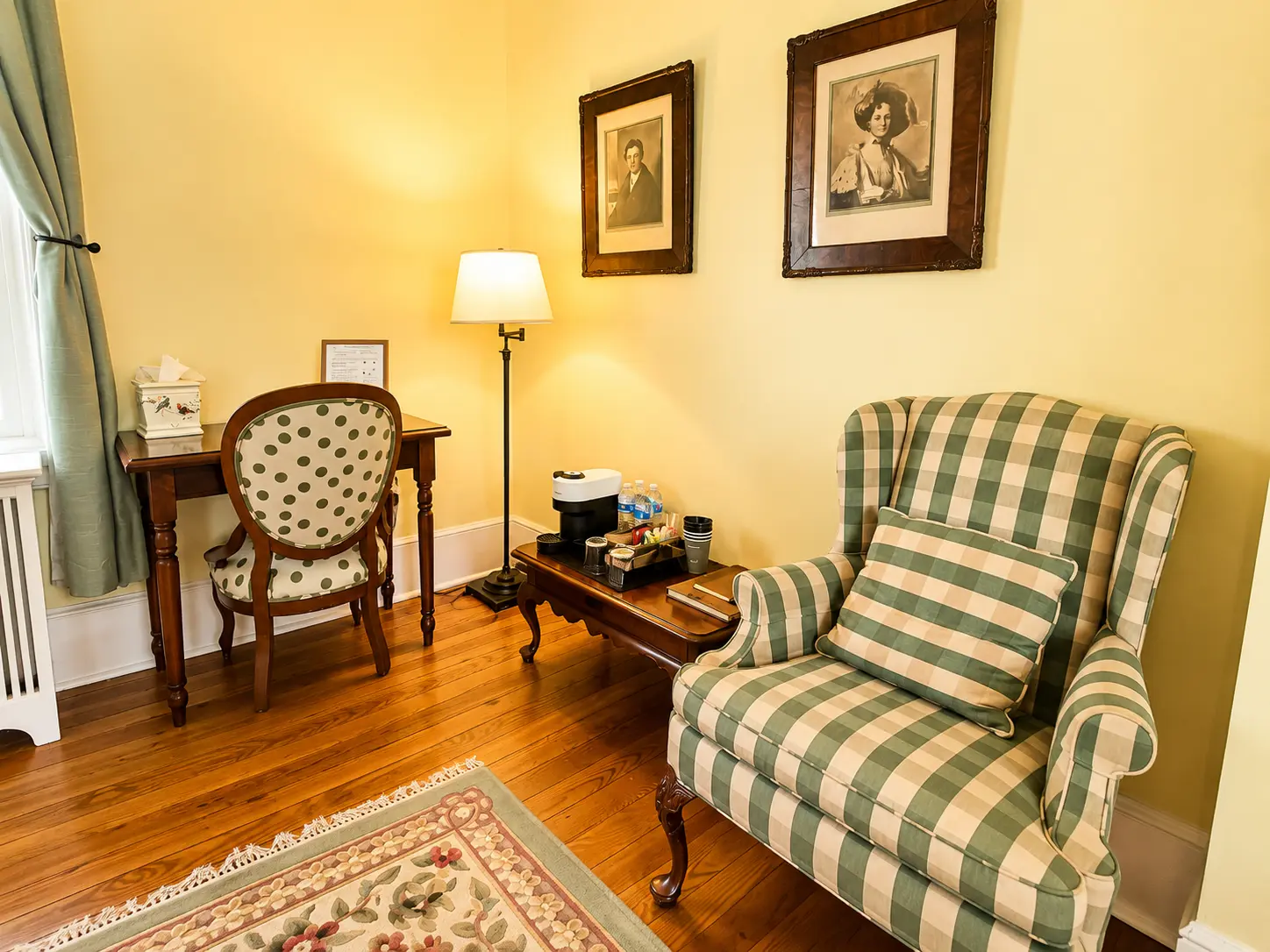 Wine, snacks, and a red armchair by a cozy fireplace.