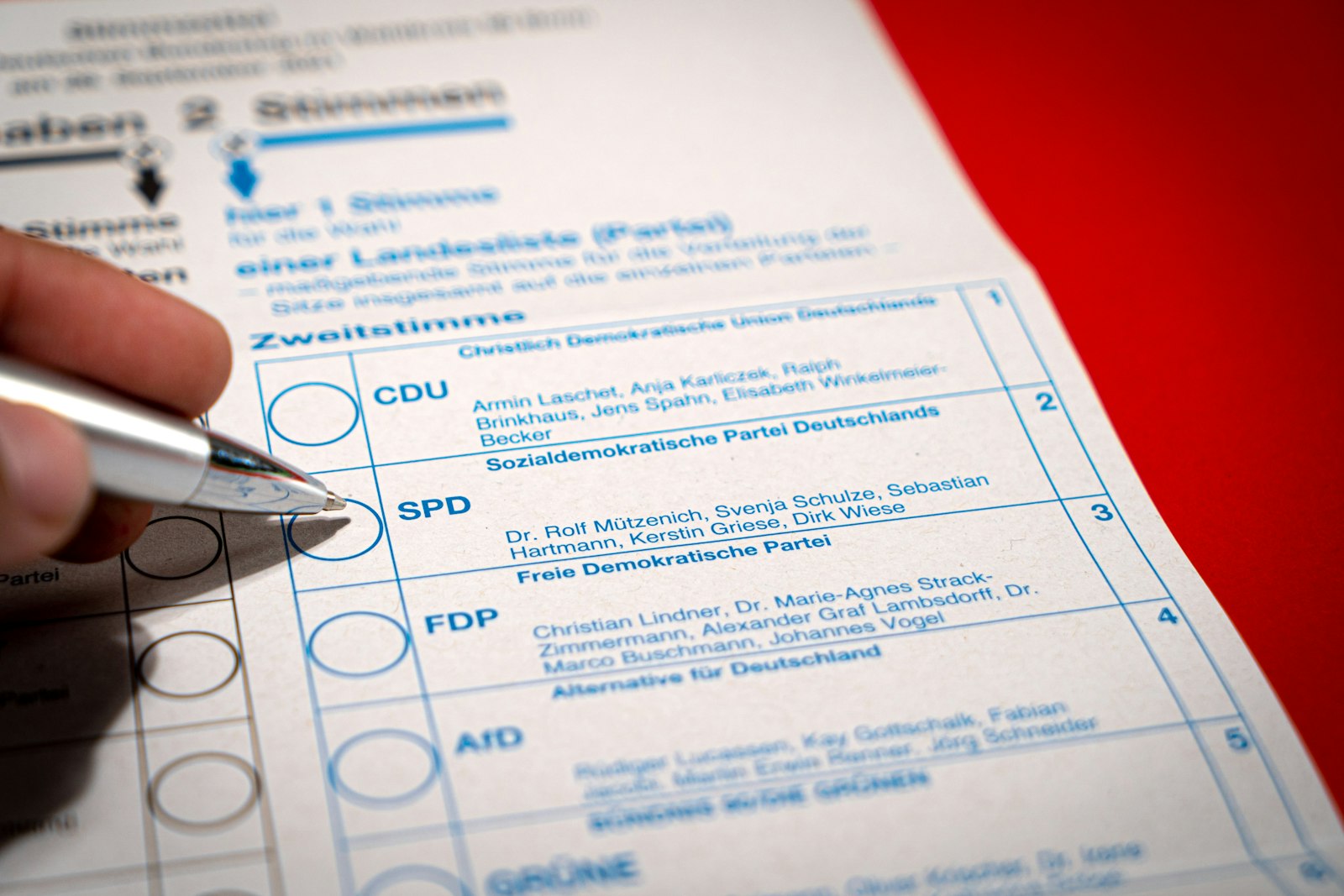 Compliance professional reviewing and filling out a laboratory test report