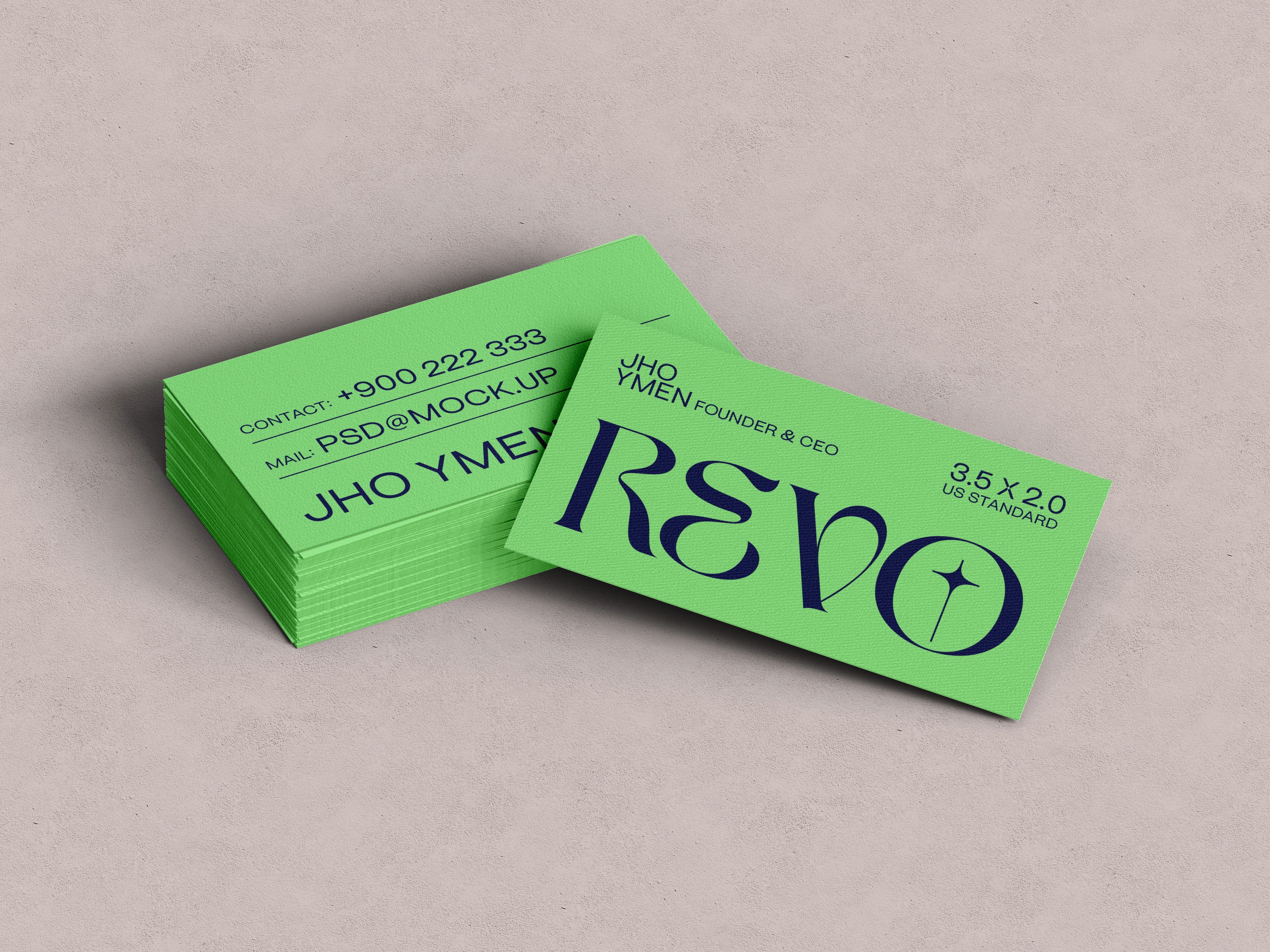 A professional brand identity mockup showcasing a stack of vibrant lime green business cards featuring the "REVO" logo in elegant black serif font, displayed on a neutral light grey background with contact details visible on the top card.