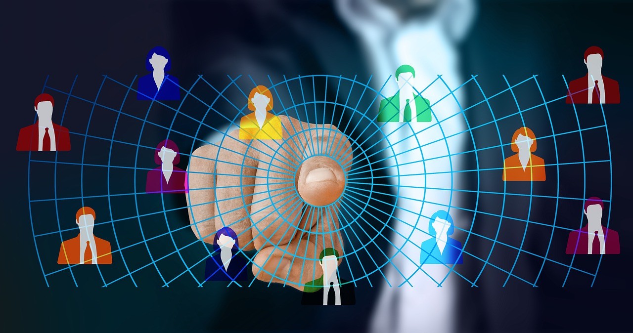 Businessman interacting with digital network of diverse user icons representing global online connectivity and communication