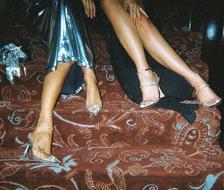 Guests hanging out on the steps in festive NYE outfits