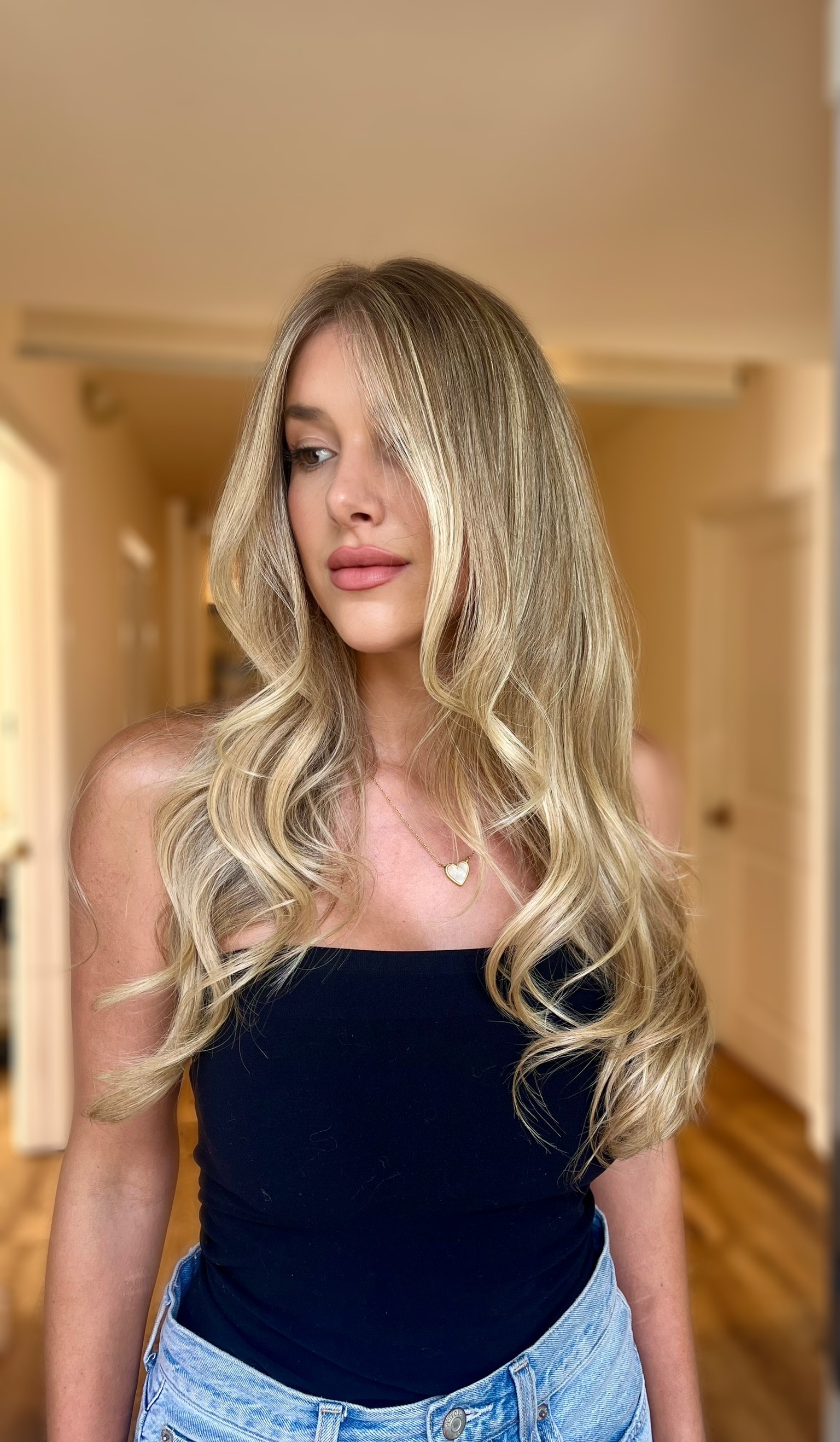 Lived-in balayage blonde at Bomane Salon, Beverly Hills – seamless blonde with natural tones.