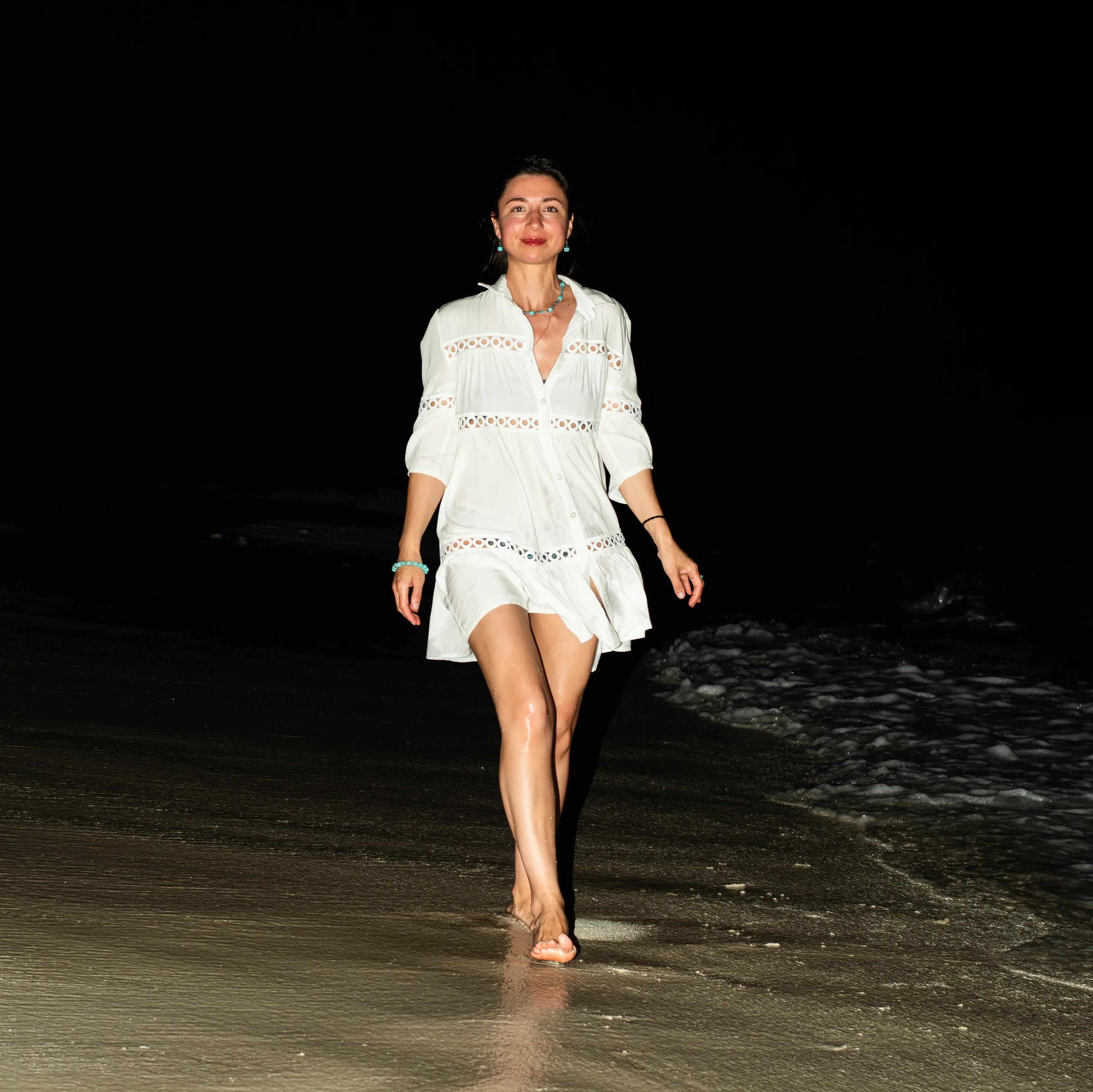 woman in black long sleeve shirt wearing white hat standing on green grass field during daytime