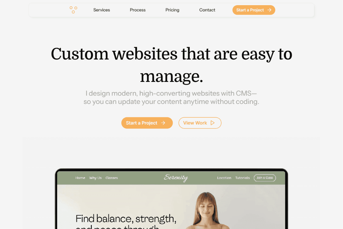 A MacBook with lines of code on its screen on a busy desk