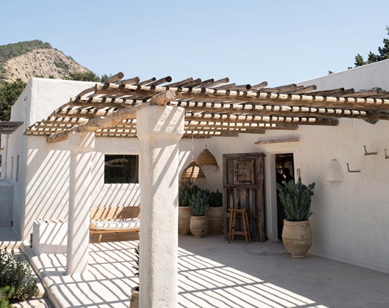 White Mediterranean home with a rustic timber pergola on the Costa del Sol