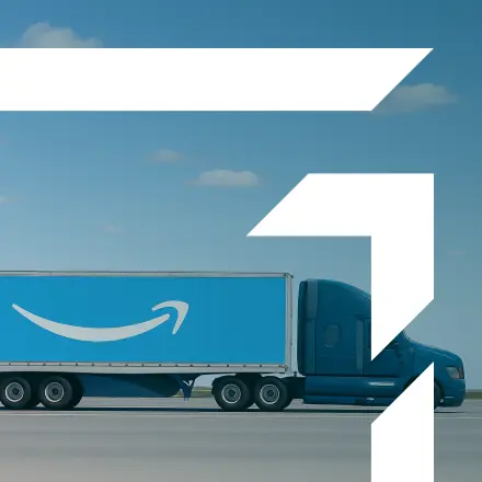 Blue semi-truck hauling an Amazon Relay trailer on the highway — representing GIA Group, LLC’s insurance solutions for carriers meeting Amazon Relay requirements.