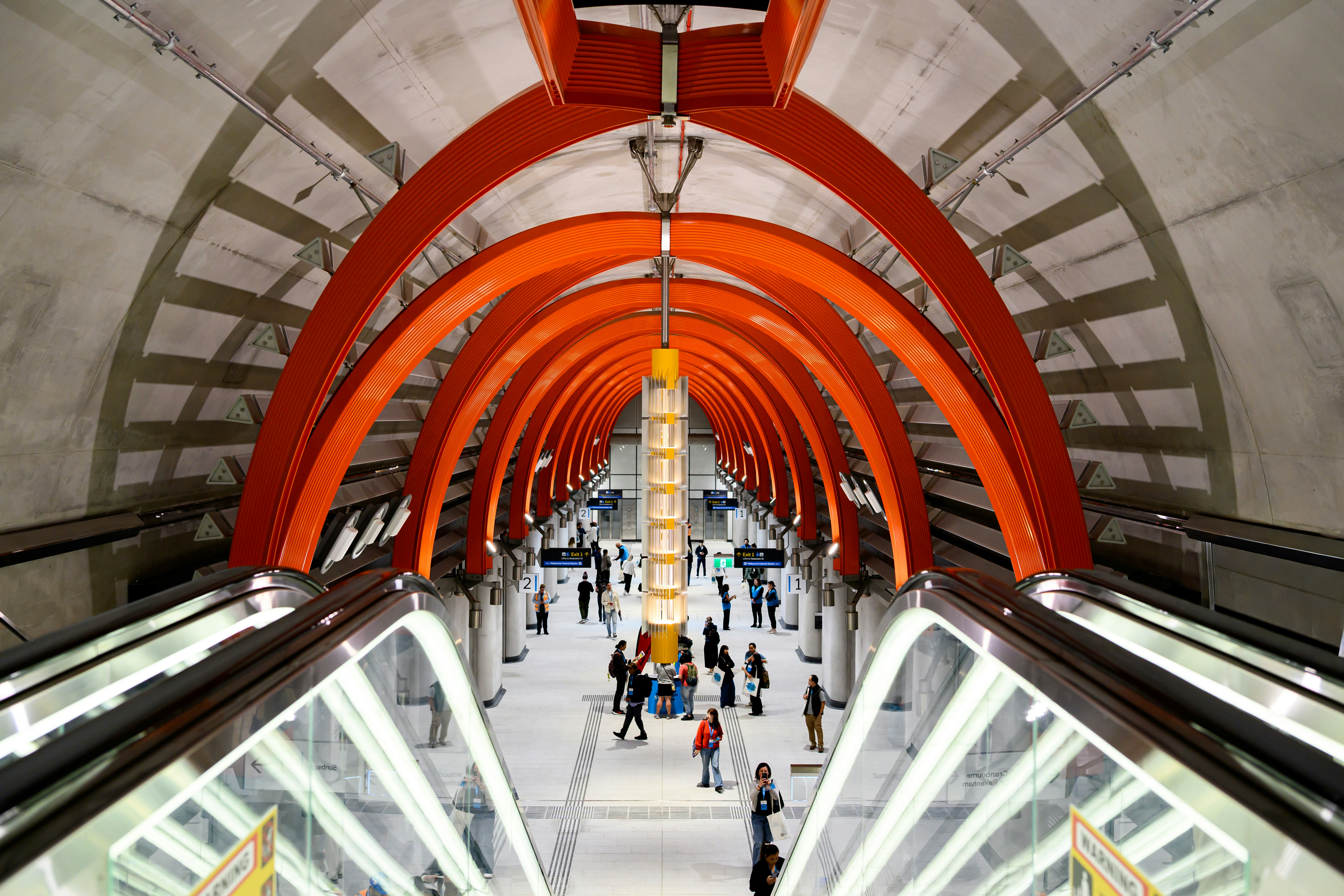 Modern subway station with orange arched ceiling