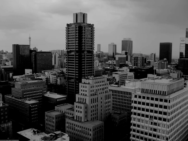 grayscale photo of city buildings