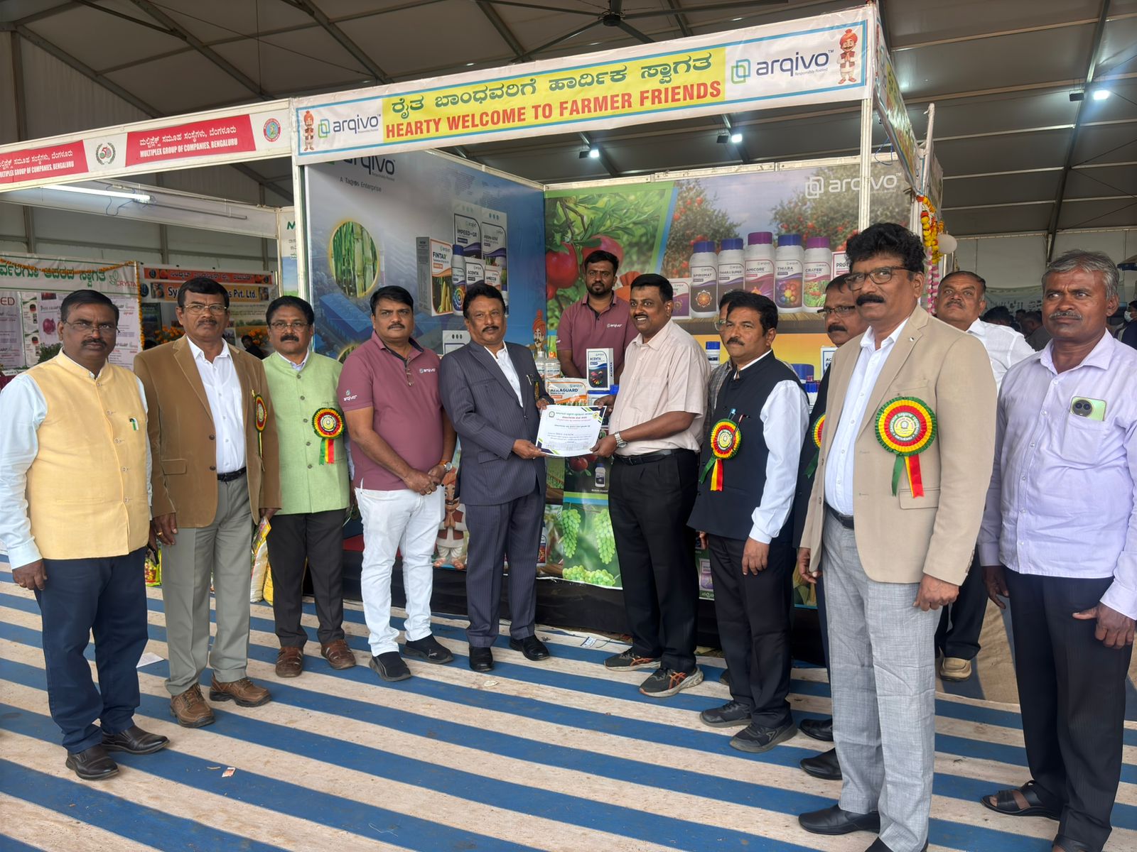 A man stading with Surfboard