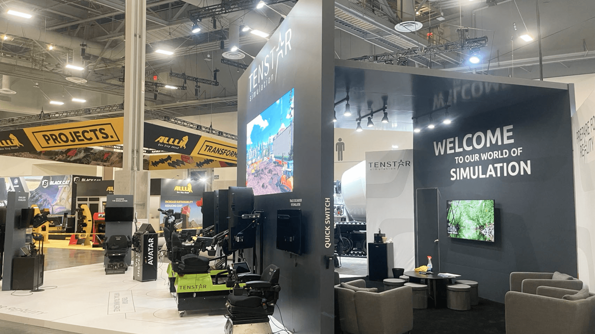 30x30 heavy equipment trade show booth in las-vegas with interactive simulator stations and structural branding canopy