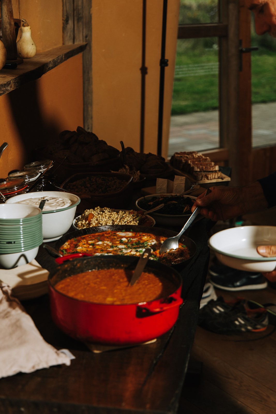 a wooden building with a large round window