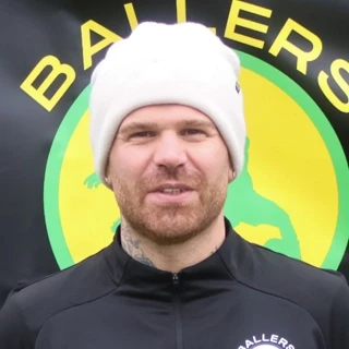 a man with a beard wearing a t - shirt that says mullehauss