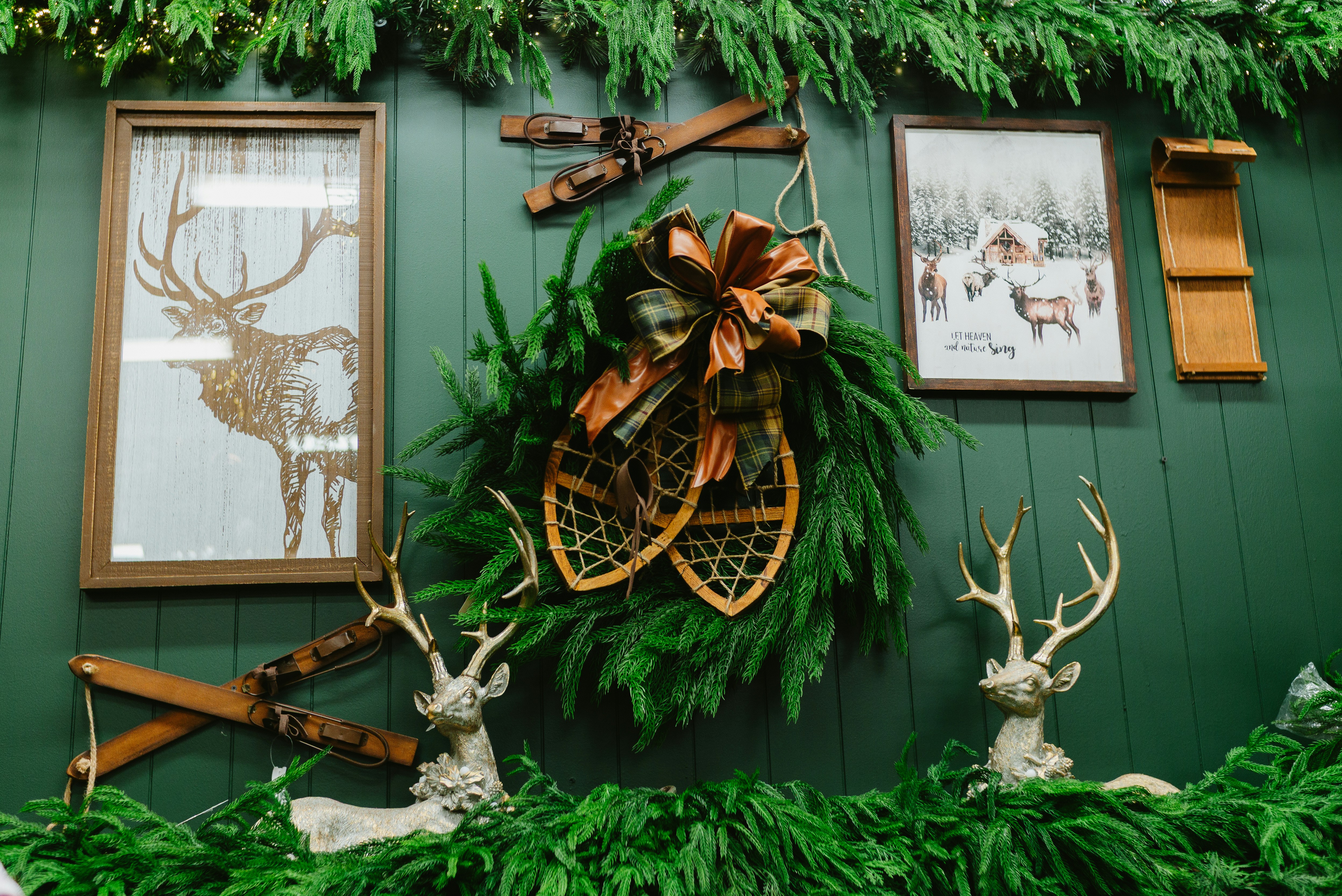 Winter-themed wall decor with deer and snowshoes