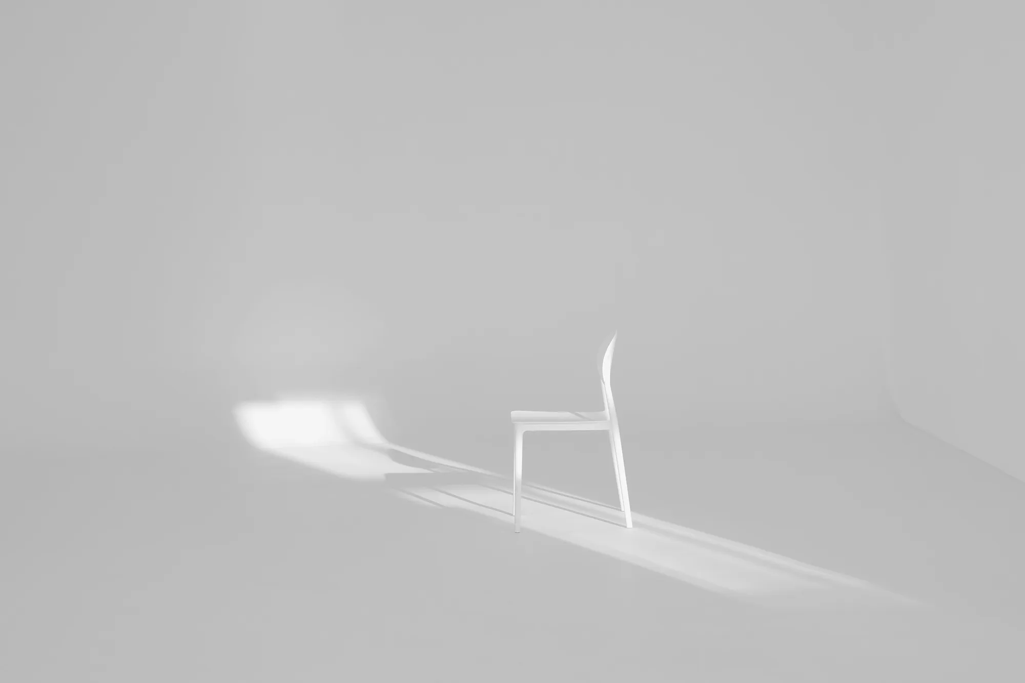 White chair in a pale room