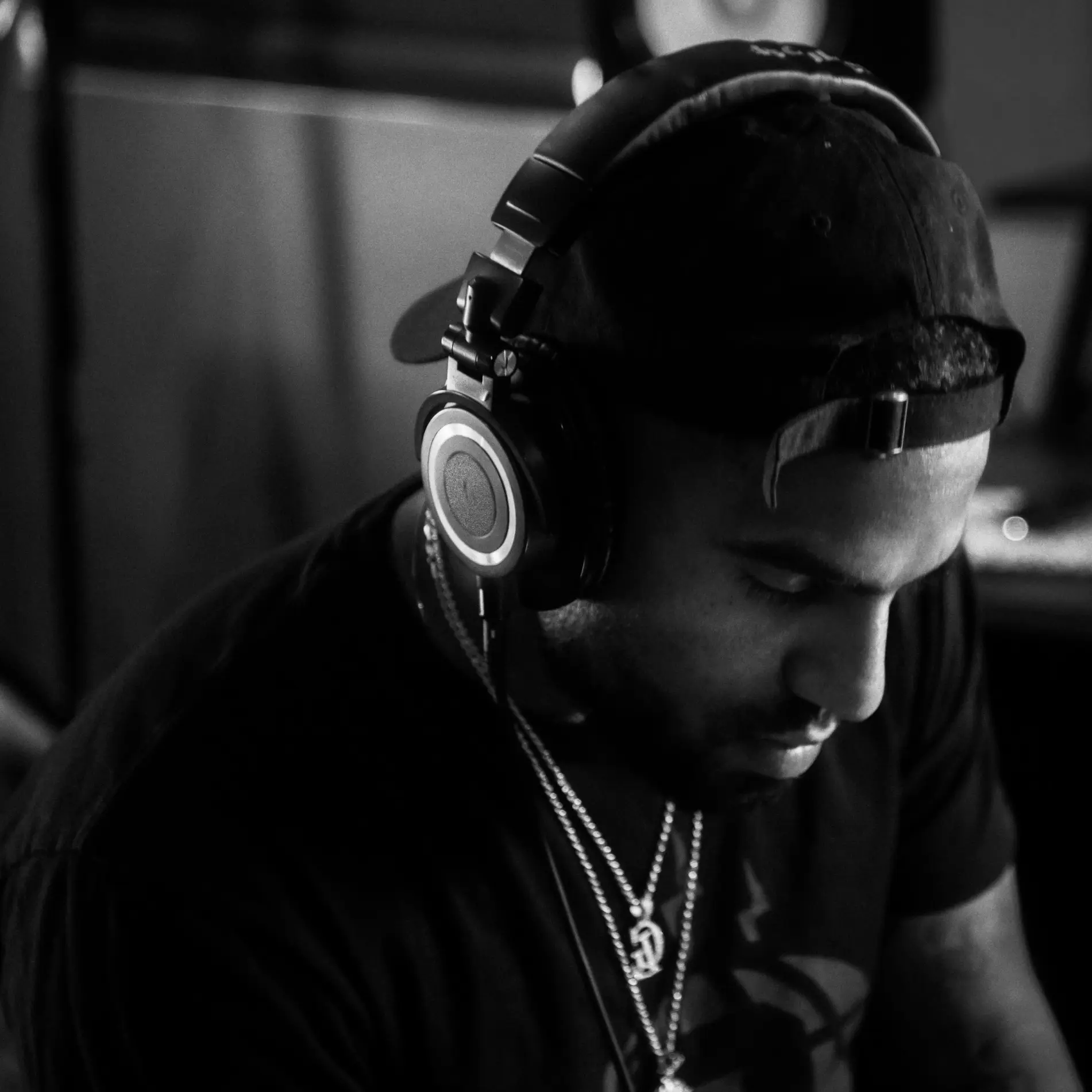 An independent artist wearing headphones.