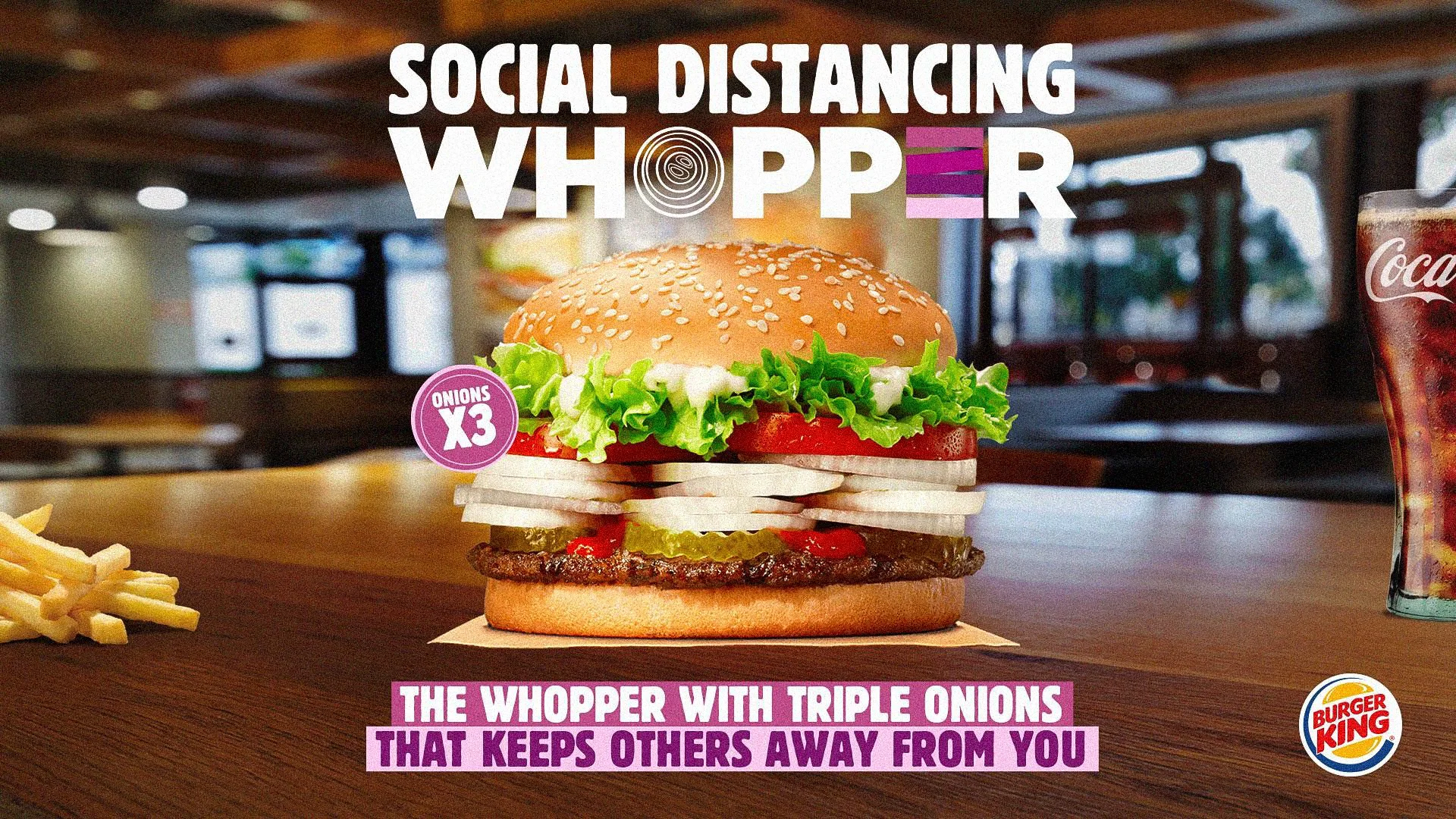 Burger King Social Distancing Whopper with triple onions X3 that keeps others away - fries and Coke on table
