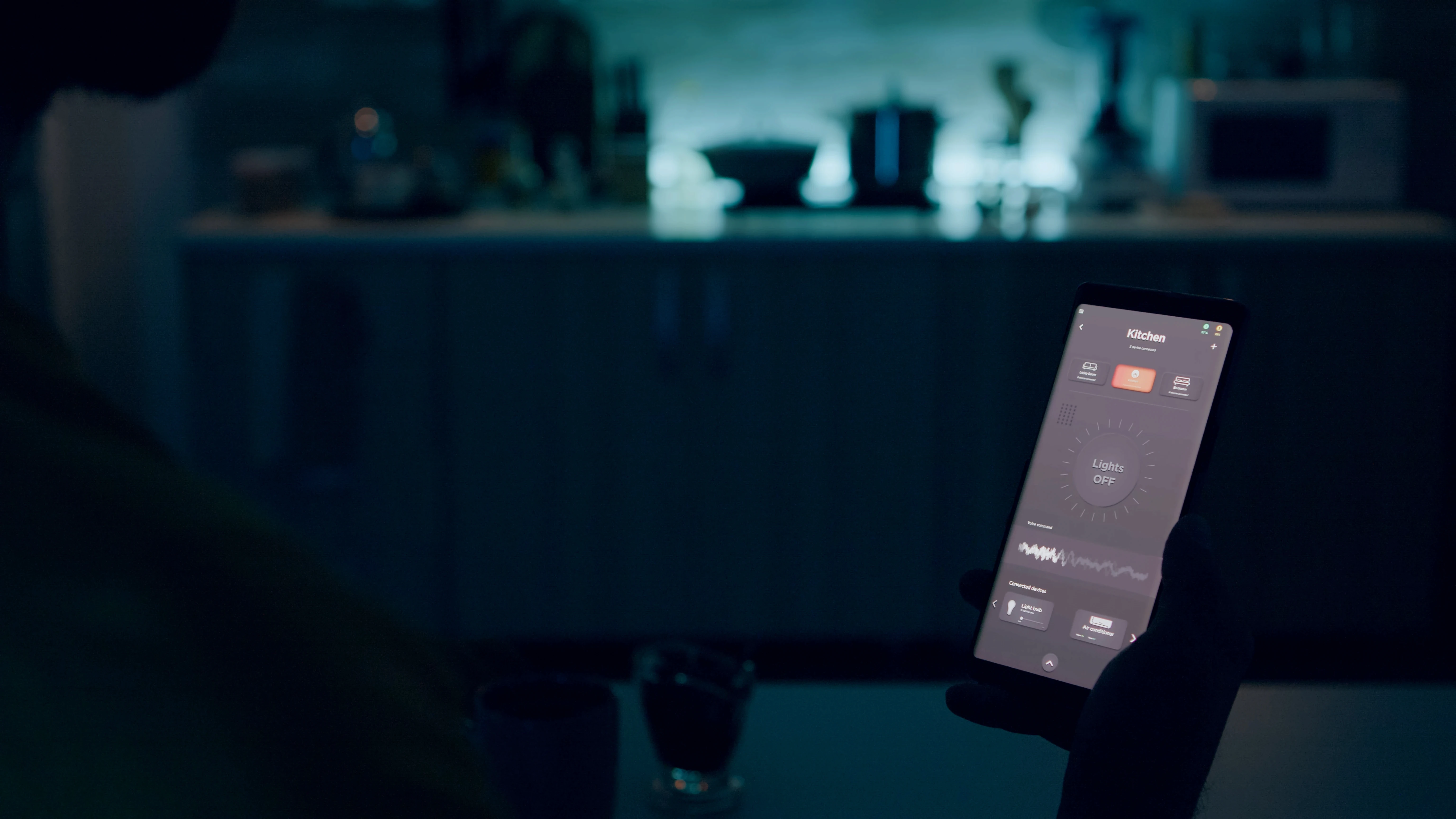 person-looking-smartphone-with-smart-home-lights-app-sitting-kitchen-house-with-automation-lighting-system-turning-bulbs-with-voice-command