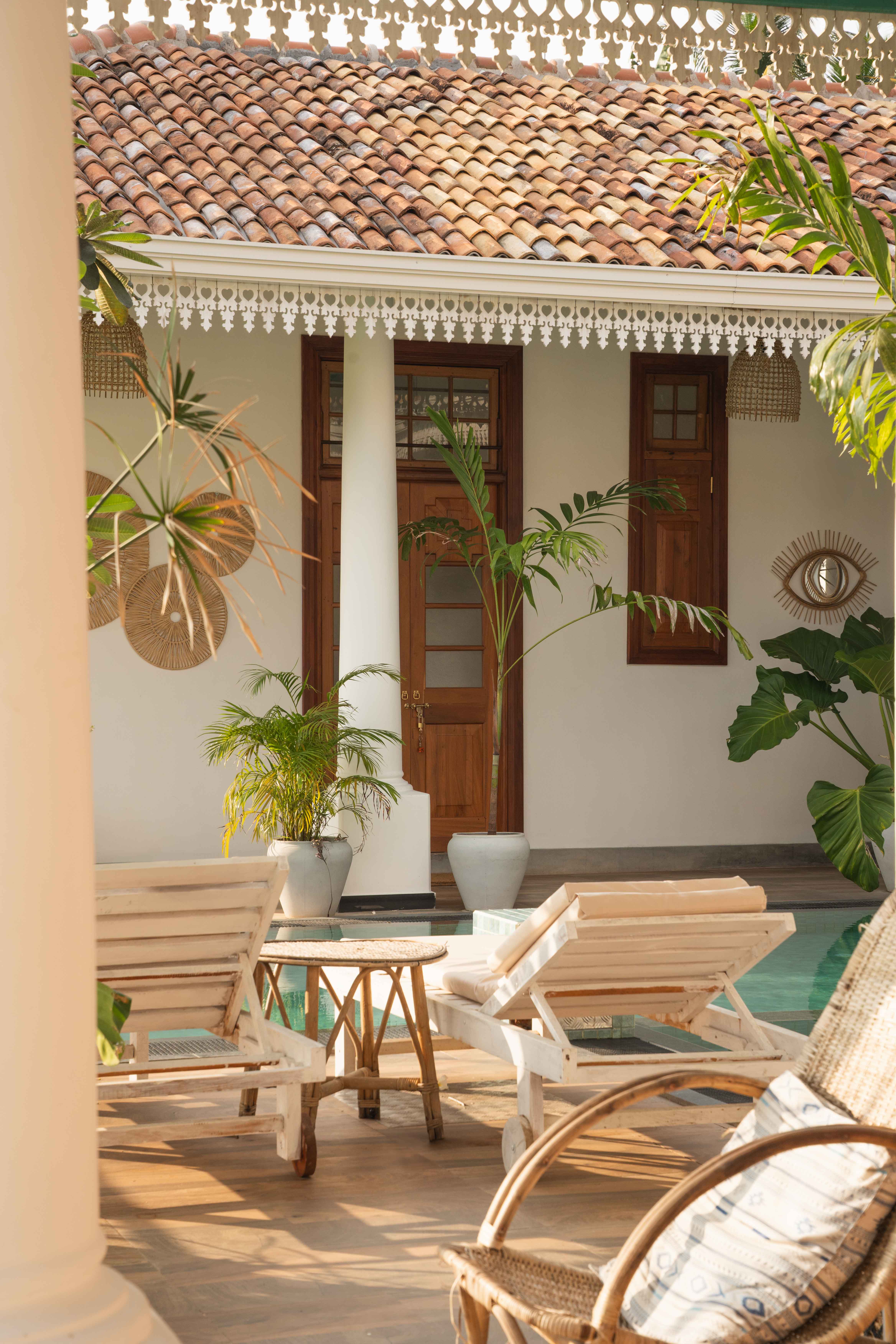 Pool area with beige sun chairs