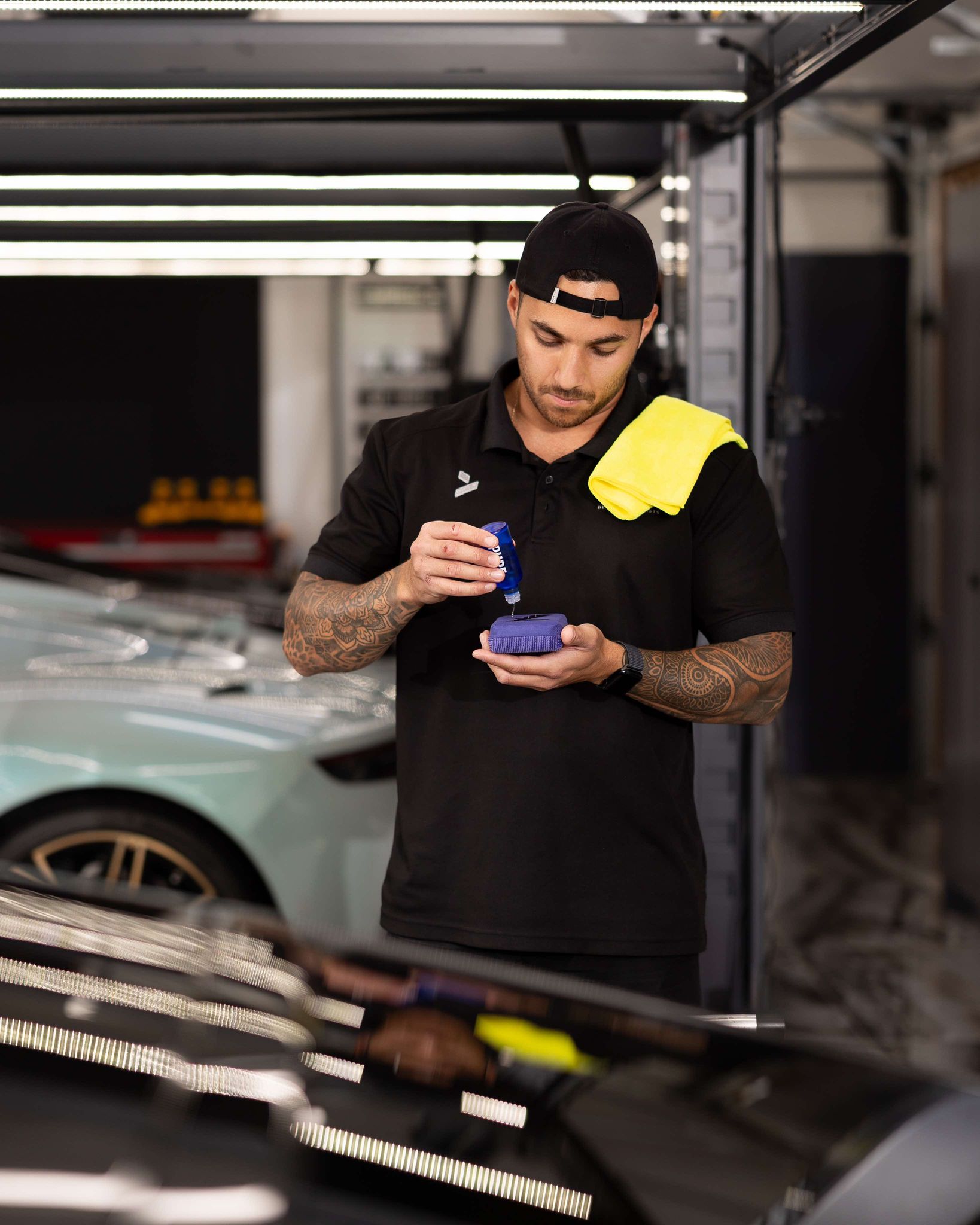 Big dog sitting next to his dad on an outdoor bench