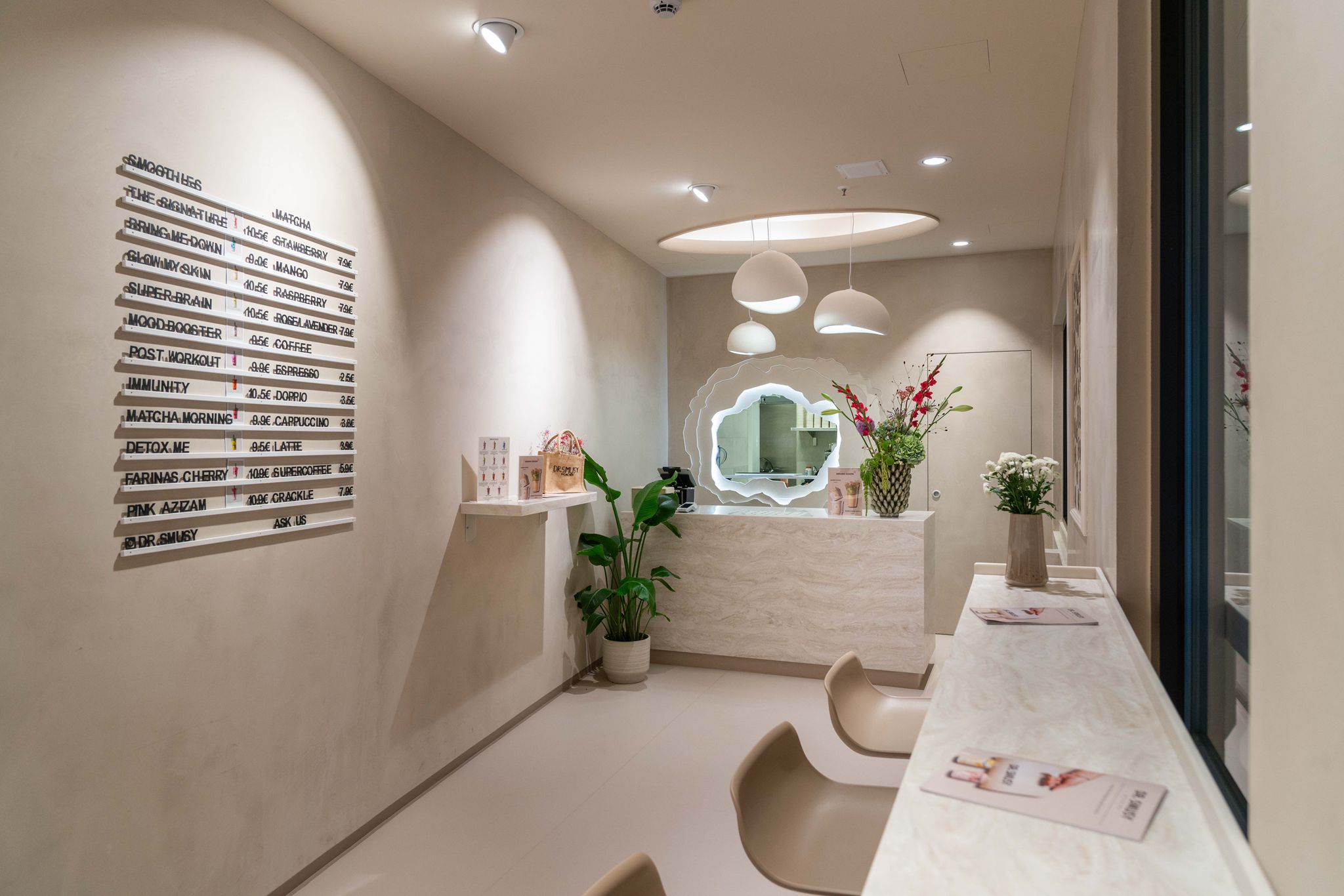 Layered latte in glass with flowers and plants