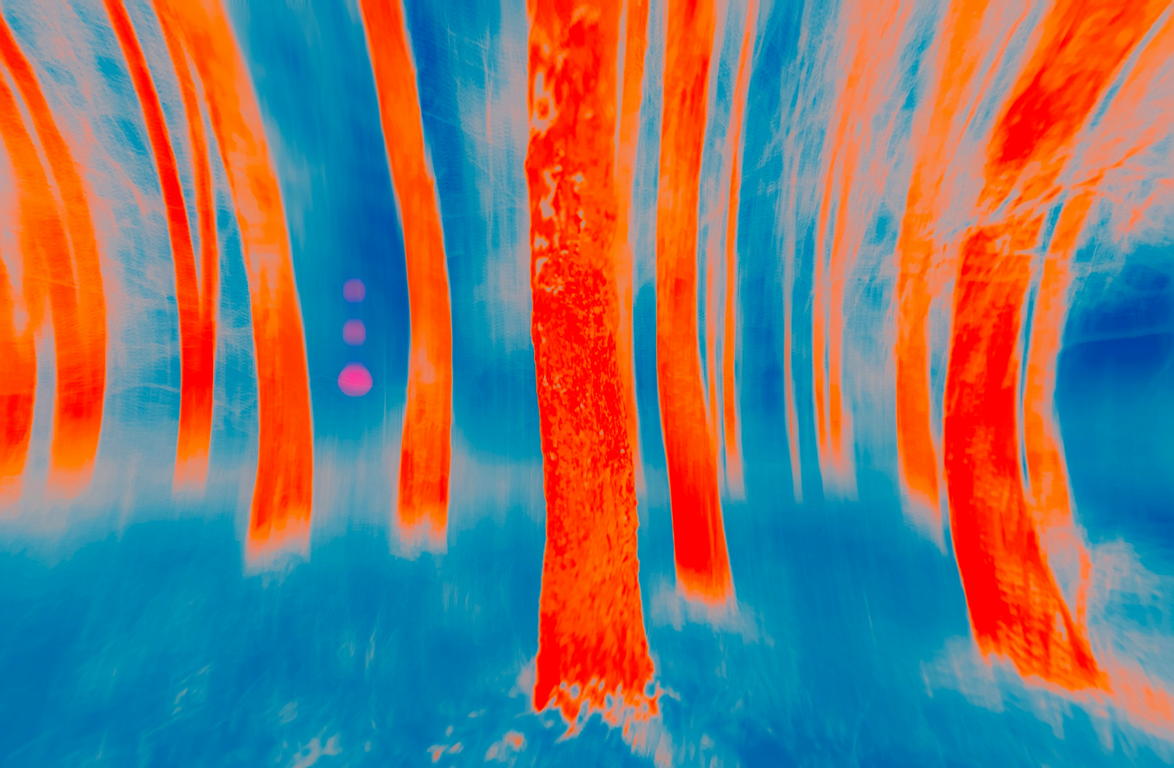 Abstract forest with blurred orange trees and blue background