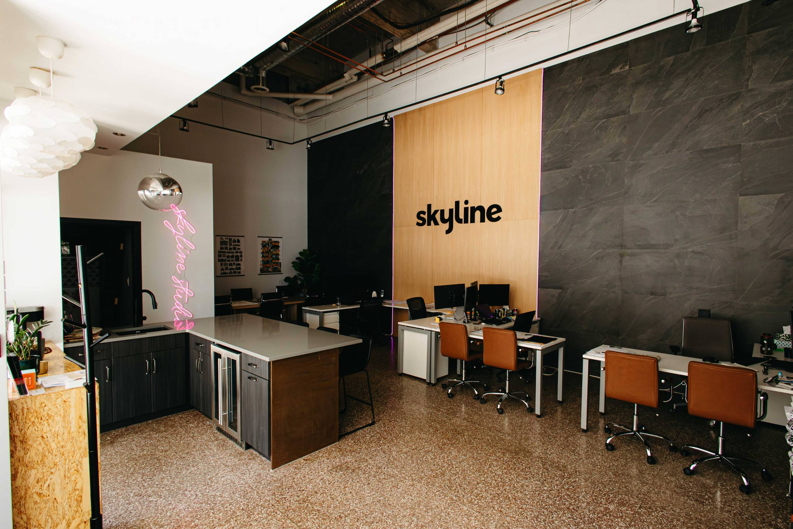 Skyline office in Saskatoon after rennovation showcasing an open office with feature wall