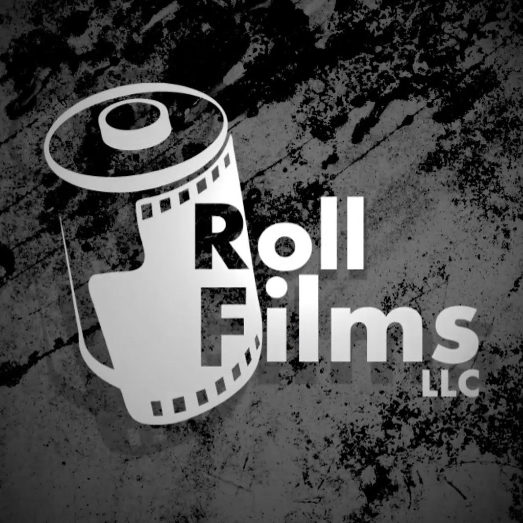 A bald eagle perches on a metal bar.