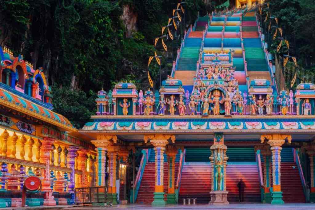 Admire the rainbow of colour at Batu Caves