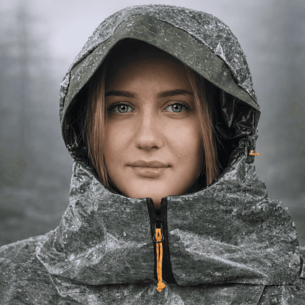 Trygg ShelterWear worn as a protective poncho during exposed outdoor conditions.