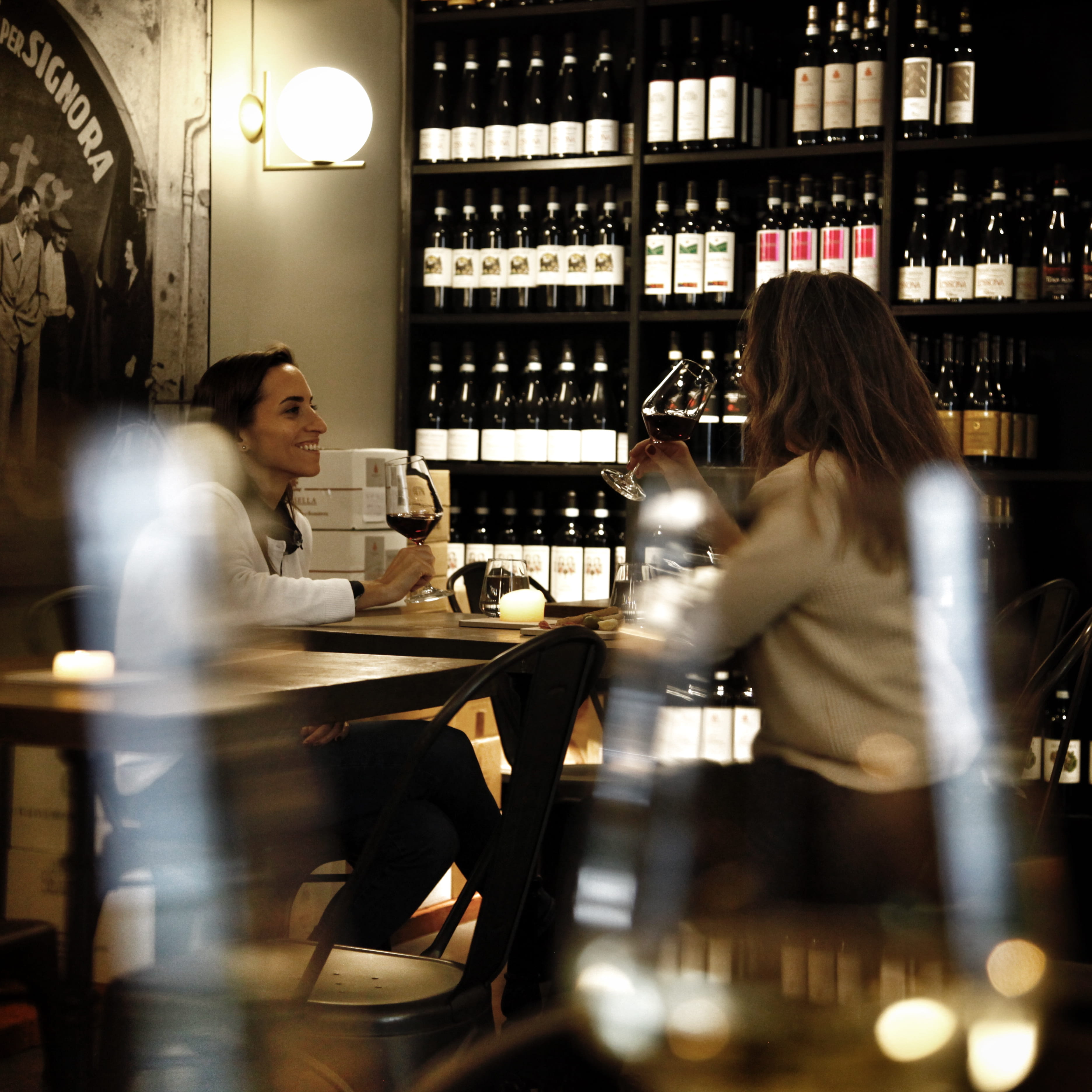 Two women drinking wine at Nebbiolo Winebar