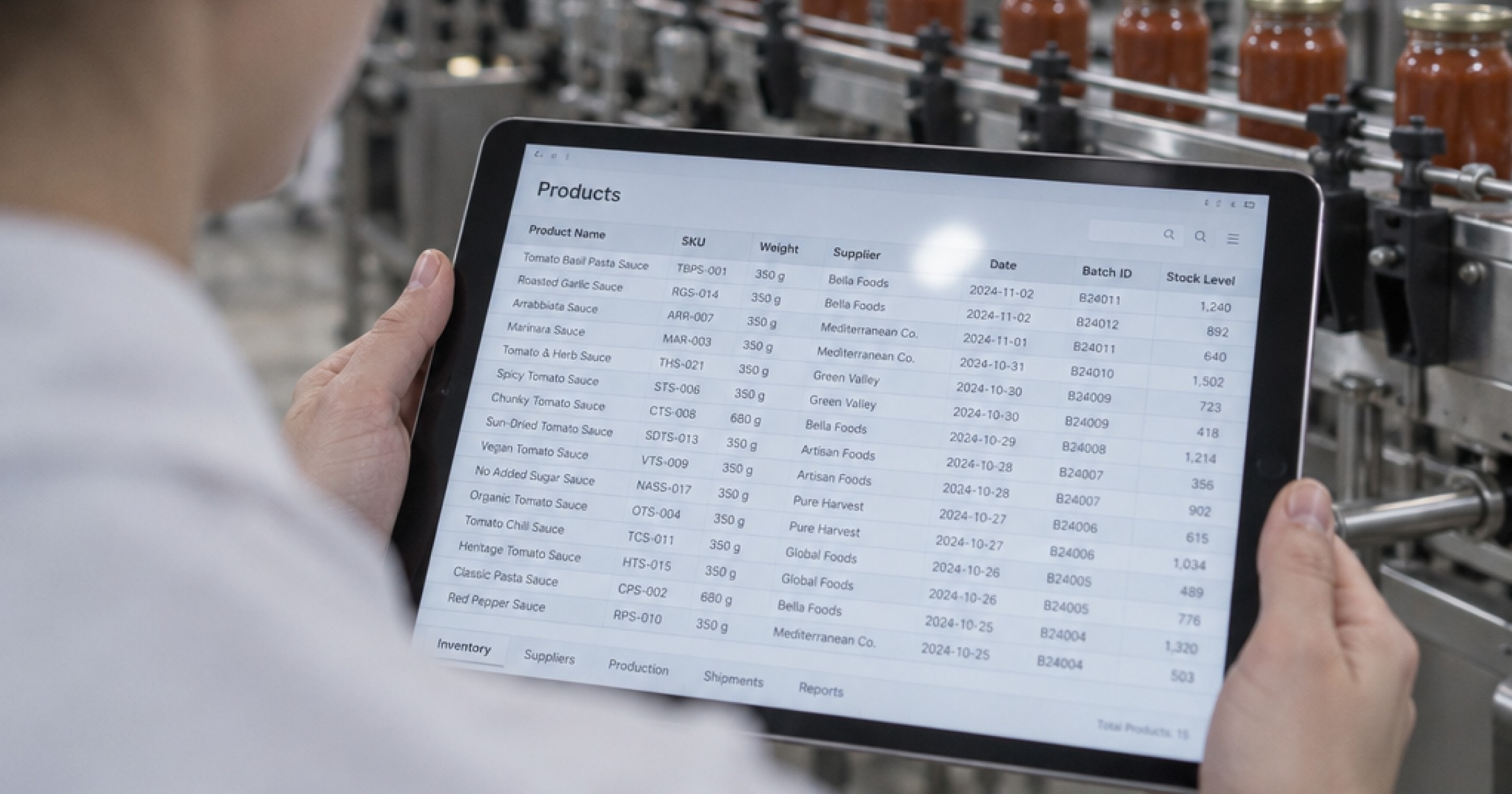 Woman holding a tablet in a food manufacturing factory