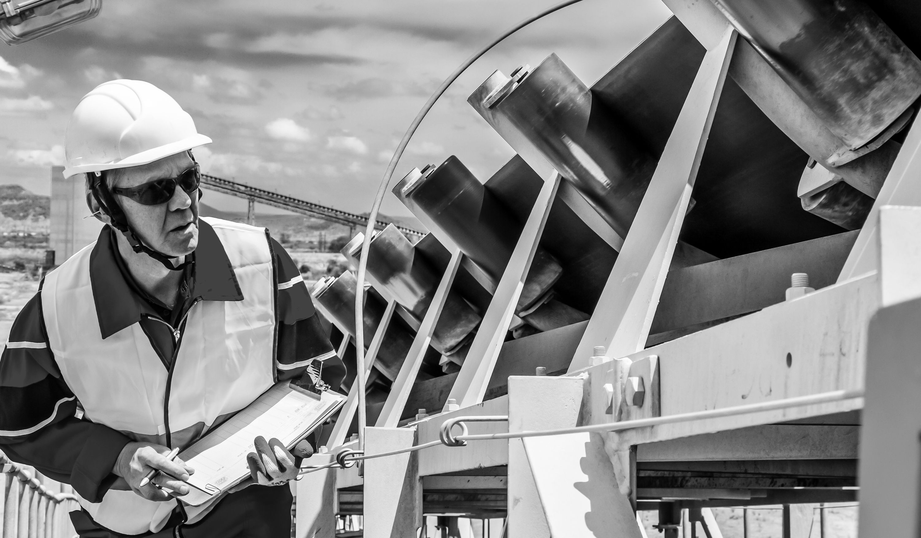 A hand with palm facing forward covered in paint.