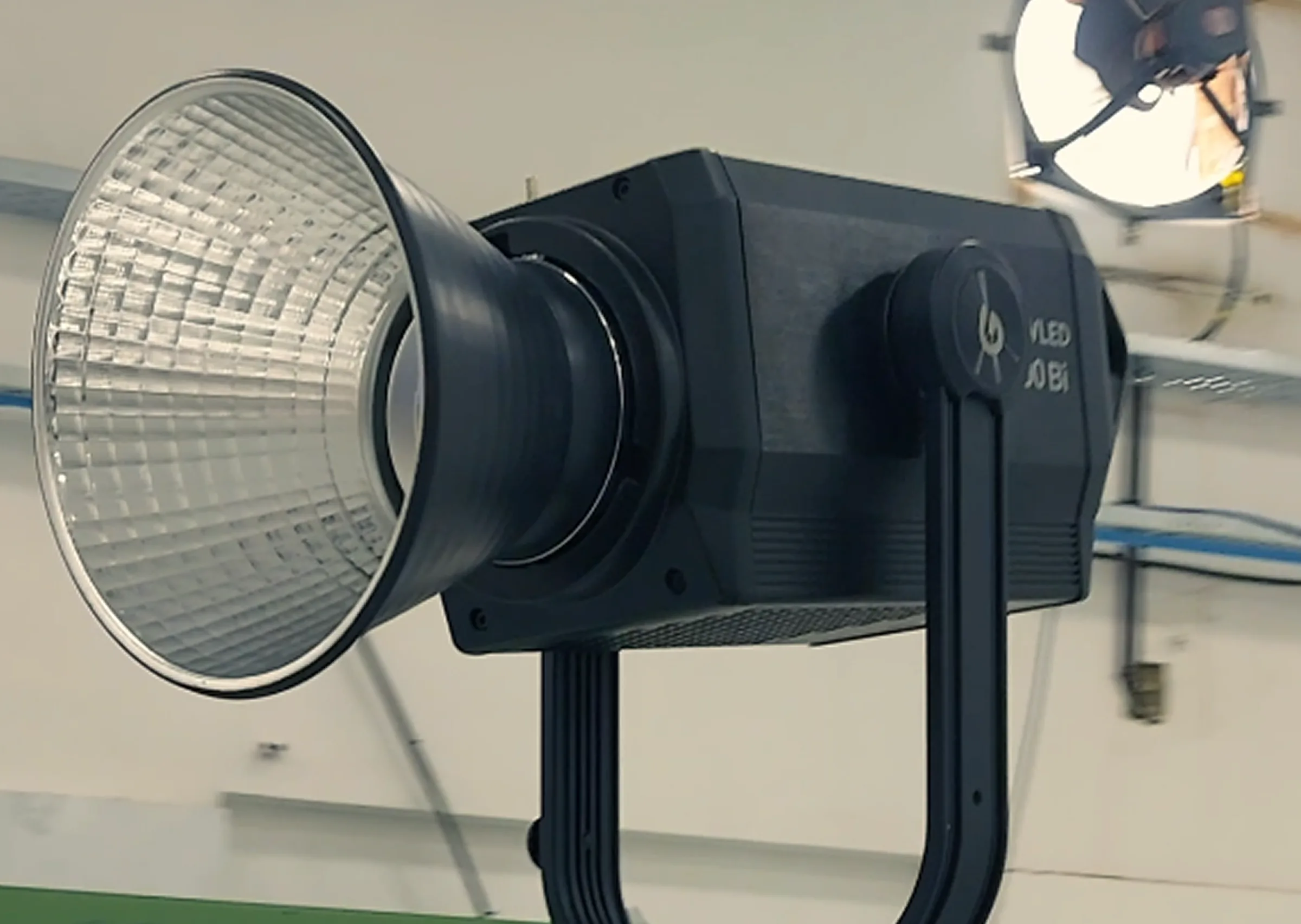 Tapecassette team setting up professional video shoot with camera and lights in a studio space