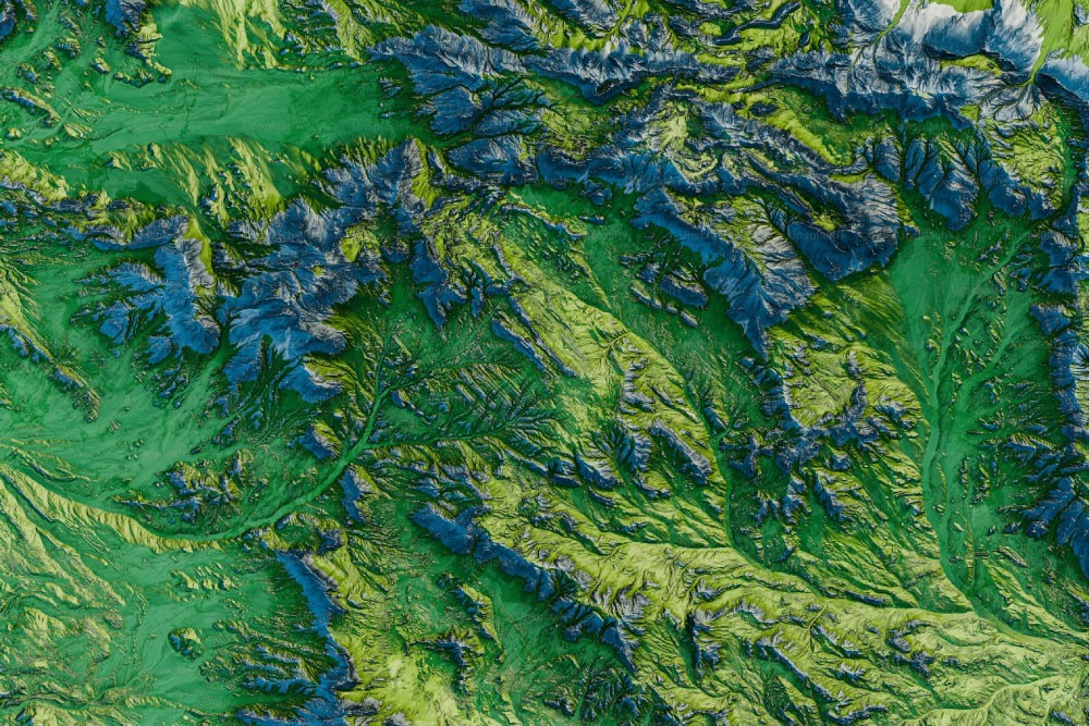 Environment sector: Topographic satellite view of lush green mountain ranges and river systems.