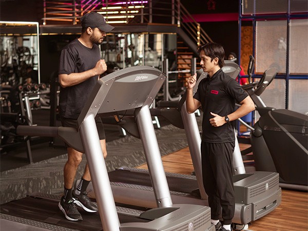 Personal Training In Kuala Lumpur, Man Running on a treadmill with a personal training coach