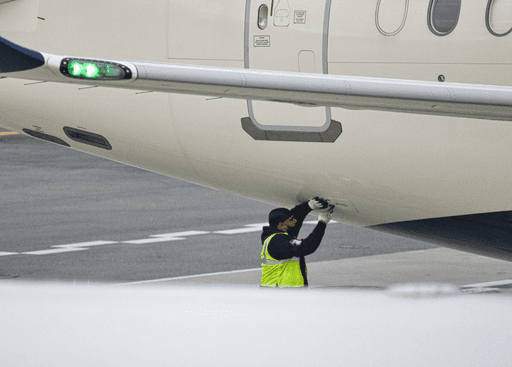 Ground crew checking airplane