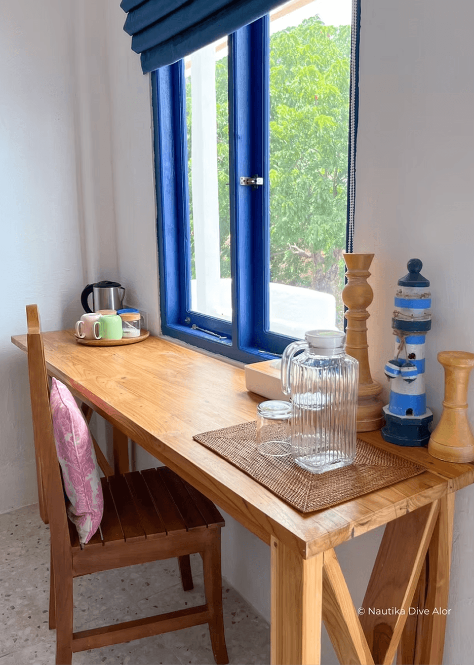 a bed room with two beds and a table