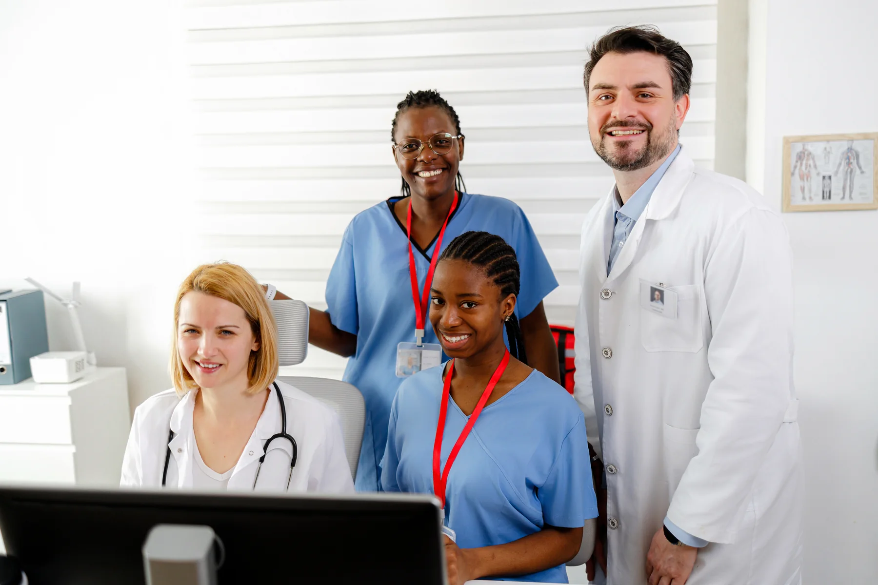 Medical Team of Doctors and Nurses Smiling in a Bright Clinic Office