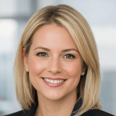 a man in a blue suit posing for a picture