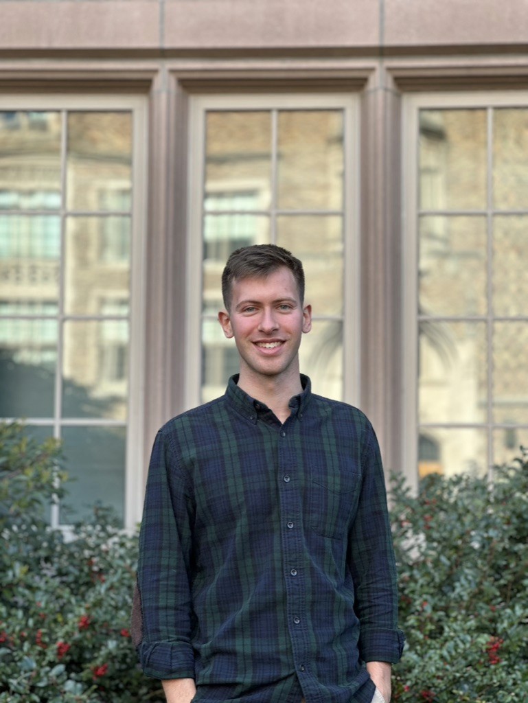 A portrait image of my standing in front of a building.