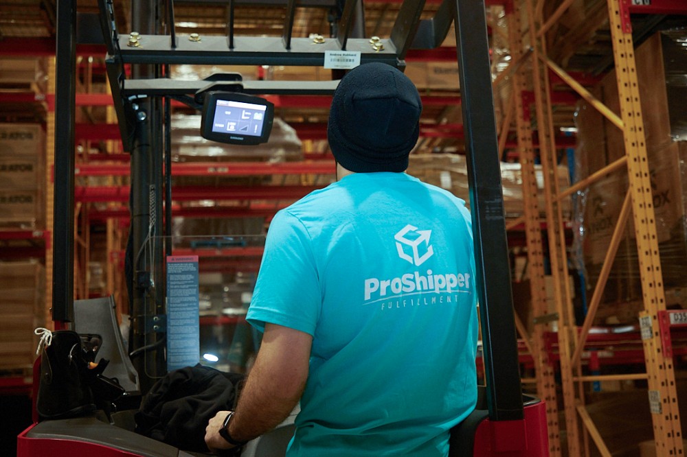 proshipper fulfillment employee using forklift truck