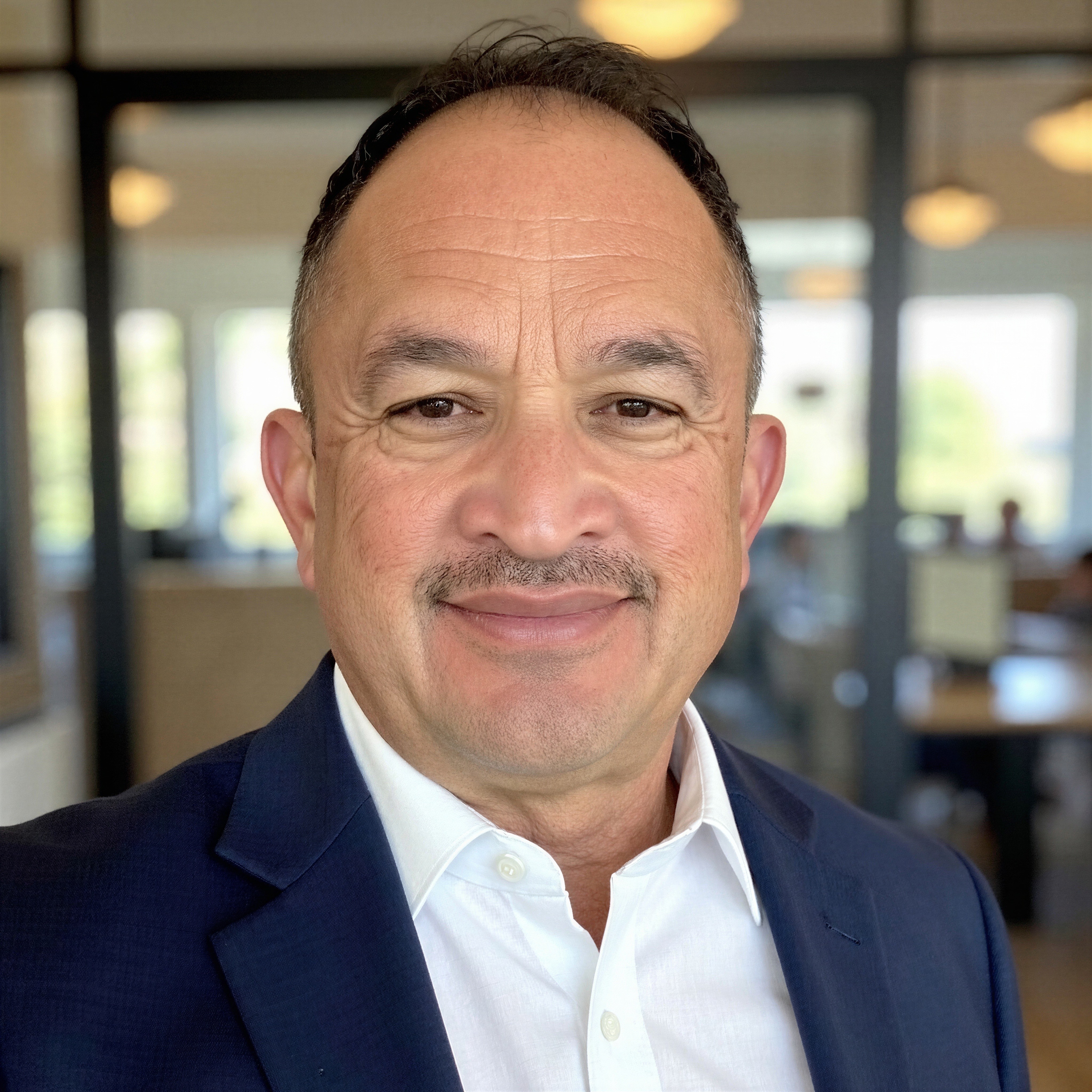 a man using a machine to pour concrete