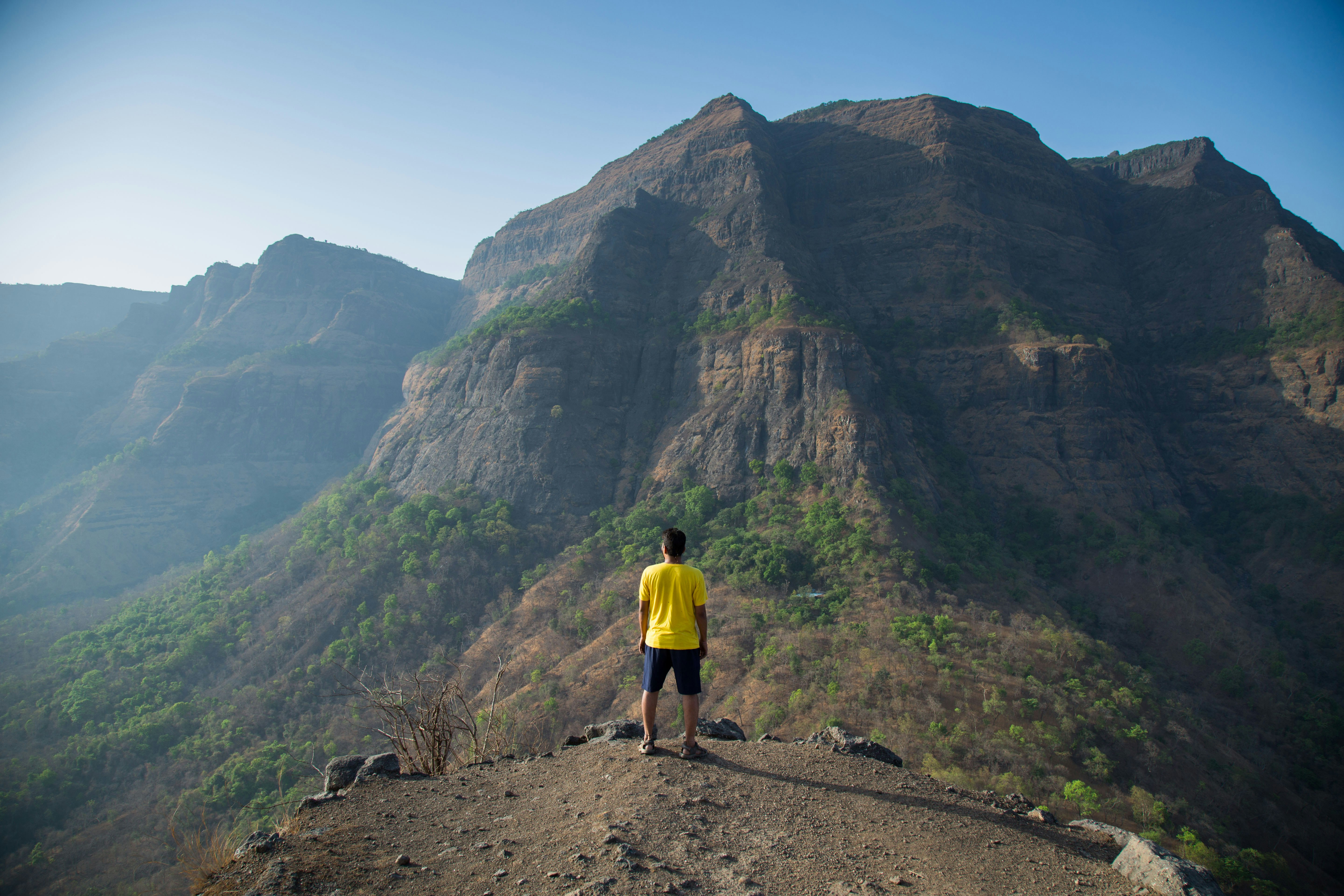 Personal Overlooking a Huge Hill Infront of Him