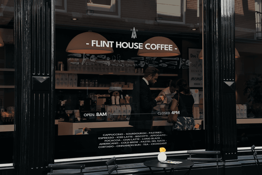 Flint house coffee logo printed on glass on cafe