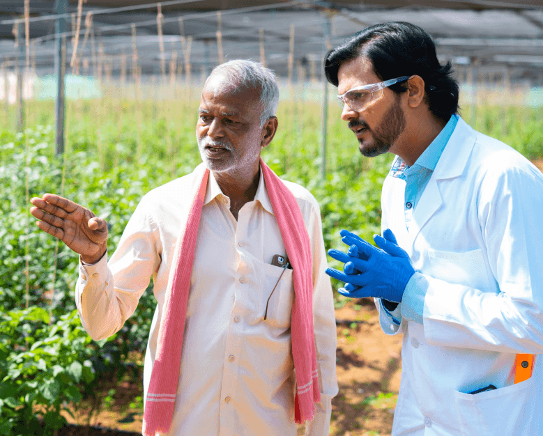 Farmer discussing crops with an agricultural researcher